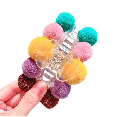 China Fashion women's headdress ball wool color hair claw Korean main claw hairpin plush handle clip hair claw back for sale