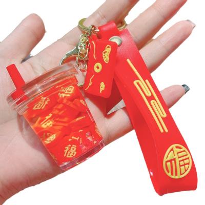 China Cute Style New National Fashion Oil Red Floating Bottle Wedding Keychain Pendant Creative Couple Bags Ornaments Vehicle Key Chain for sale