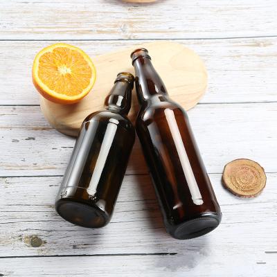 China Drink Well Selling 330Ml Amber Beer Glass Bottles With Lids 26Oz Crown Cap for sale