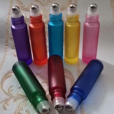 China Personal Care Cosmetic Packaging 10ml Color Essential Oil Glass Roll On Perfume Lip Oil Bottle With Cap for sale