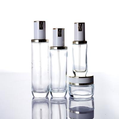 China Personal Care Wholesale Customization Round Glasspump Clear Cosmetic Packaging Bottles Jar for sale