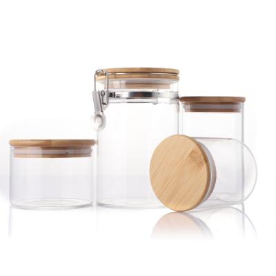 China Classic Wide Mouth Round Borosilicate Kitchen Food Glass Storage Airtight Jar With Wooden Bamboo Lid for sale