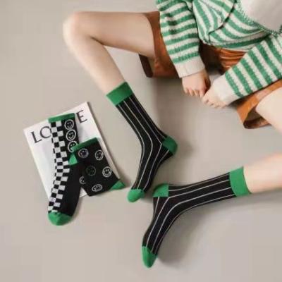 China Korean Women's Sport Cotton Socks Black Central Institute of Statistics Men's and Women's Mid-Tube Socks Checkerboard and Green Striped Fashionable Smiling Face for sale