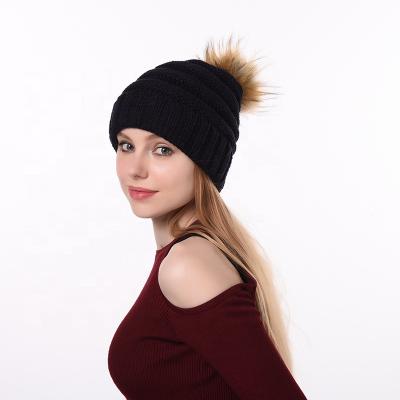 China Women's winter beanies new hat 2021 retro logo design strap hat men's modern black simple ribbed bulky oversized pom pom customized COMMON for sale