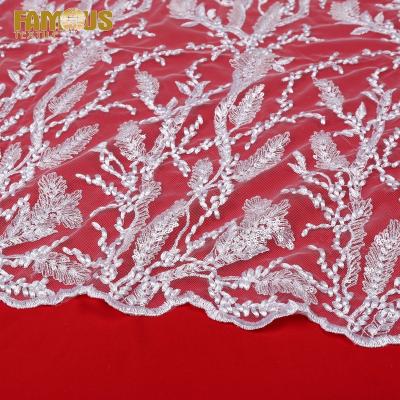 China Other ready to ship fancy white thailand embroidery lace net fabrics with transparent sequin for wedding dress for sale