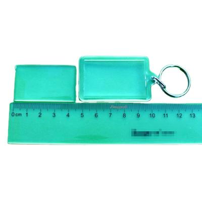 China Plastic inside custom size-44*27mm white acrylic photo key chain for sale