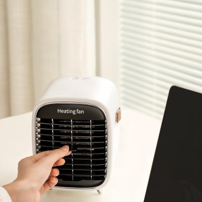 China Hotel Table Design Cheap Price Portable PTC Heater Mini Home Electric Fan Heater Hand Held For Room for sale