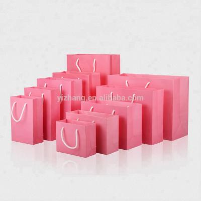 China 10*12*6cm Plain Pink Recyclable Kraft Paper Doll Packaging Hot Selling Gift Bags With Rope Handle for sale