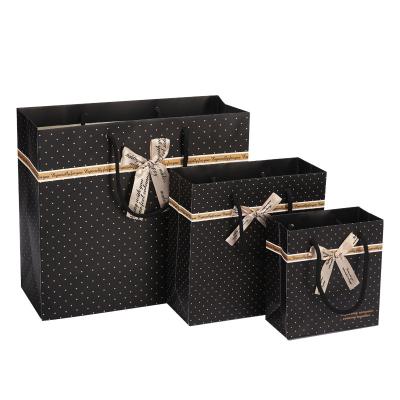 China Recyclable High Quality Custom Cheap Black Paper Gift Bag With Ribbon Decoration for sale