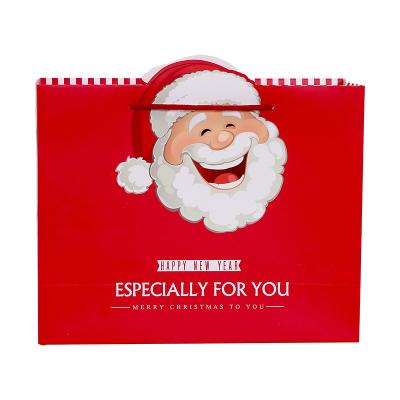 China Recyclable Christmas Maker Red Paper Christmas Paper Packaging Gift Bags With Red Handle for sale