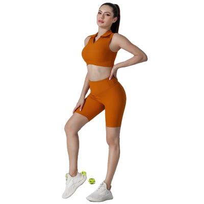 China Breathable quick dry sports bra set crac! crack! butt gaiters custom made tennis skirts orange color high quality 2 piece tight fitting tennis skirts for sale