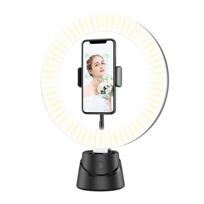 China 360 Degree Rotating Phone Holder Smart 360 Camera Fill Light Rotating Object Tracking Live Broadcast Phone Stand for sale