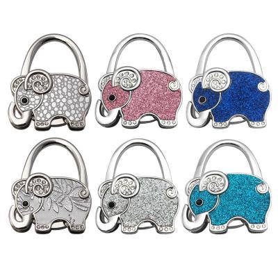 China Foldable Elephant Bag Holder Portable Metal Handbag Hook For Table for sale