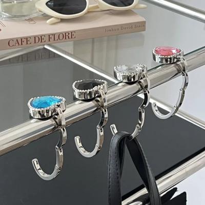 China Crystal Alloy Foldable Handbag Hook Heart Shape Bag Table Hanger Hook for sale