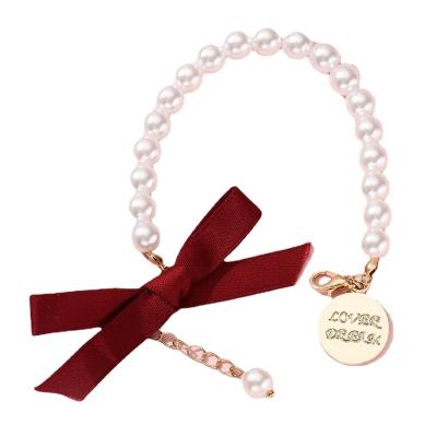 China FASHIONABLE Luxurious Exquisite Letter Bead Bowknot Charm Bangle Charm Dangling Bracelet Dream Lover Bracelet For Women Girls for sale