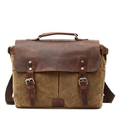 China Waterproof Vintage Canvas Messenger Bags Men Square Waxed Belt Buckle Cross - Body Bags For Women Laptop Handbags for sale