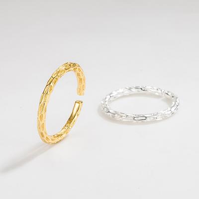 China Unique Potholes Environmentally Friendly Design 925 Silver Surface Gold Plated Adjustable Irregular Twist Rings for sale