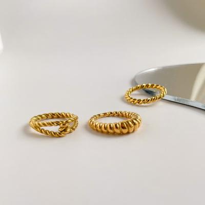 China Trendy Trendy Personality Stainless Steel Simple Twist Woven Rings Gold Plated Crescent Rings for sale