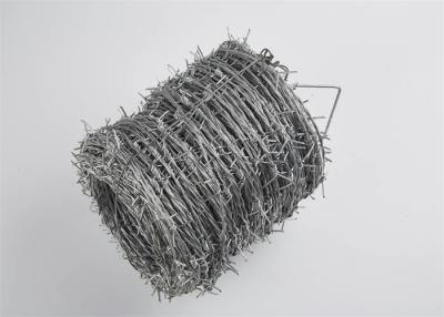 China Hot Dipped Galvanized Barbed Wire Reverse Twist 20cm Aperture for sale