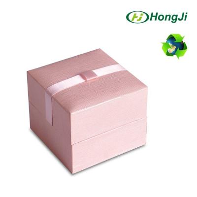 China Emboss Fancy Pink Ribbon Hinged Insert Square Silk Jewelry Box for sale